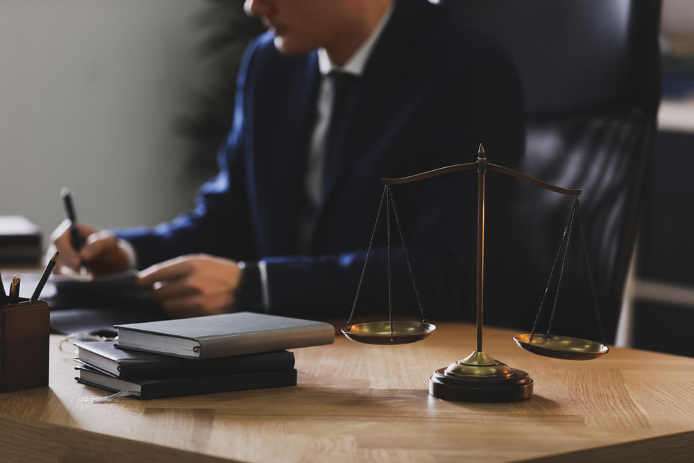 Lawyer and his client arguing while signing a document