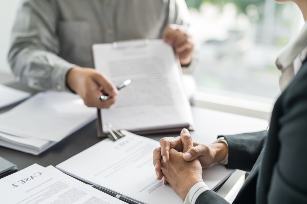 Lawyer and client signing a contract