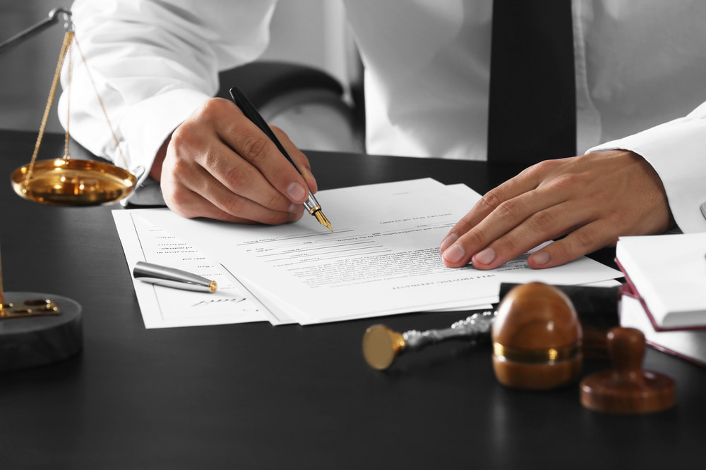 Lawyer reviewing his client's documents