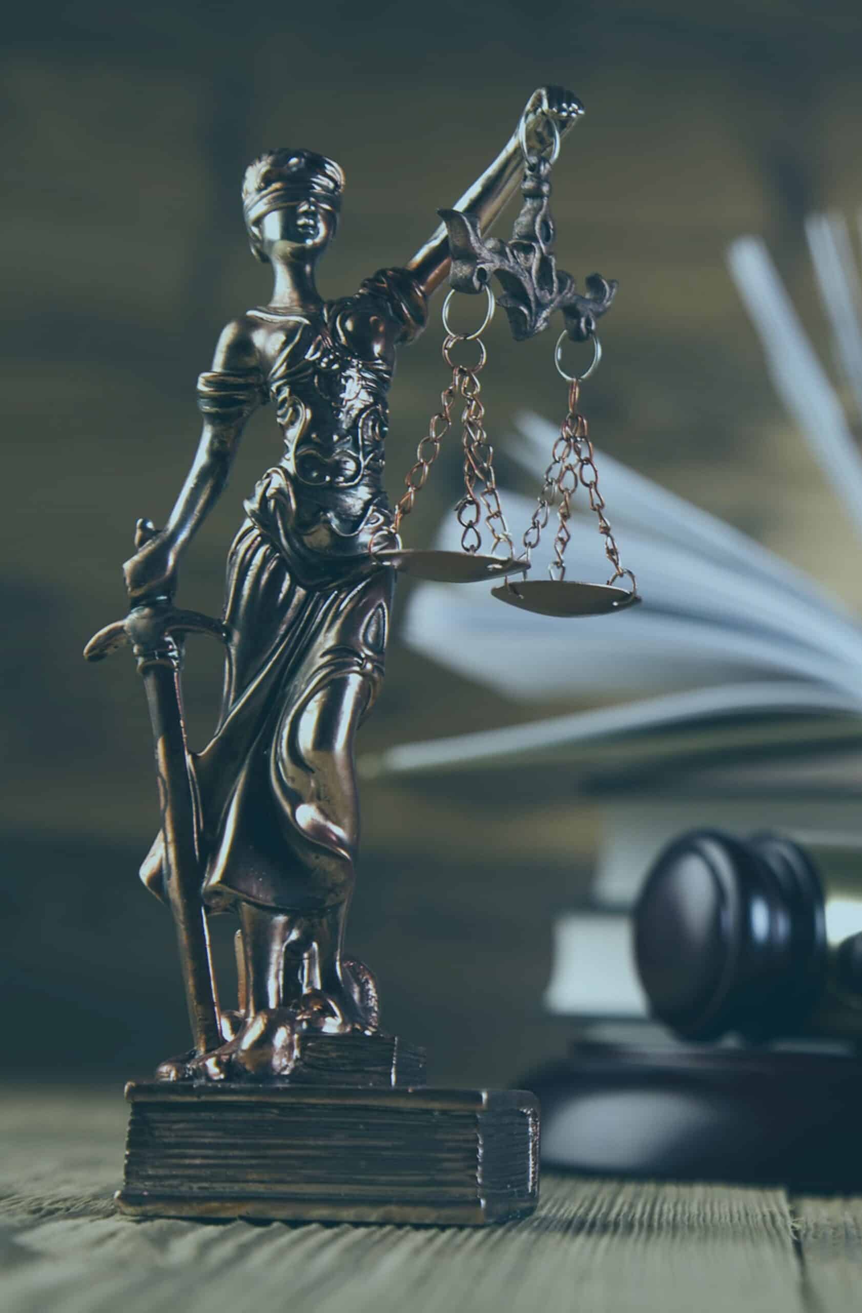 Bronze statue of Lady Justice holding scales and sword